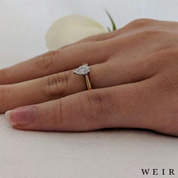 Yellow gold/platinum pear shape cut diamond engagement ring