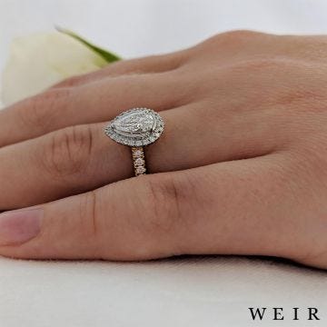Yellow gold/platinum pear shape cut diamond engagement ring