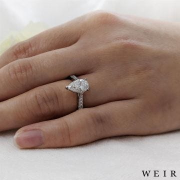 Platinum pear shape cut diamond engagement ring