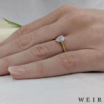 Yellow gold/platinum pear shape cut diamond engagement ring