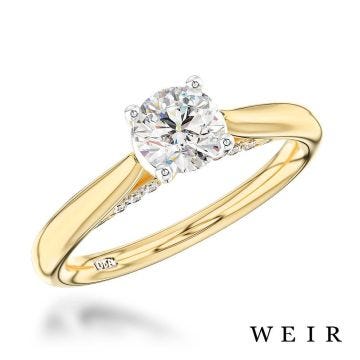 Yellow gold/platinum round brilliant cut diamond engagement ring