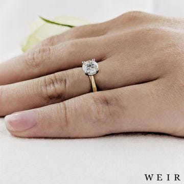 Yellow gold/platinum round brilliant cut diamond engagement ring