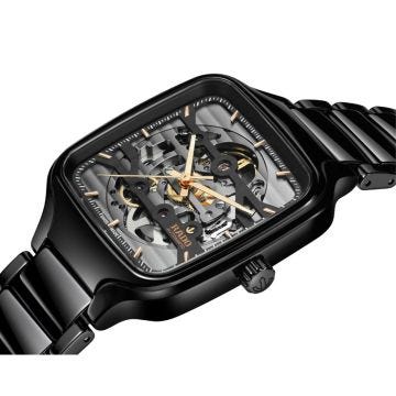 Experience the captivating craftsmanship of the Rado True Square Automatic Skeleton 38mm watch. Featuring a bold black dial and revealing its intricate automatic movement, housed within a sleek ceramic case, this timepiece seamlessly merges style with eng
