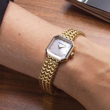 Photo of the Herbelin Octogone 22.2mm Watch 17436BP19 featuring a refined yellow gold PVD bracelet, an elegant octagonal case, and a shimmering mother of pearl dial with minimalist detailing.