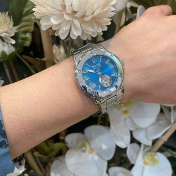 Photo of the Bulova Marine Star 98L317 watch with a striking blue dial, stainless steel case, and automatic movement.