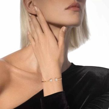 Photo of the Messika 18K Yellow Gold My Twin Toi & Moi Thin Diamond Bangle 07222-YG showcasing a modern design with shimmering diamonds