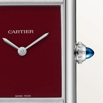 Photo of the Cartier Tank Must 33.7 x 25.5mm Red Dial Quartz Watch WSTA0054, featuring a rich red lacquered dial, sleek stainless steel case, and matching red leather strap