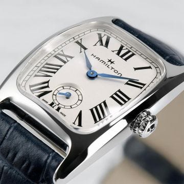 Photo of the Hamilton American Classic Boulton Small Second 24x27mm White Dial Quartz Watch H13321611, featuring a vintage-inspired tonneau case, crisp white dial with small seconds sub-dial, and a sleek navy leather strap.