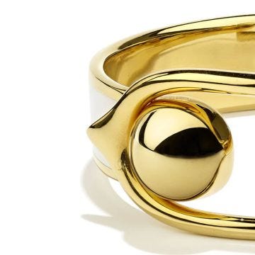 Photo of the Goossens Boucle Large White Resin Gold Plated Bangle – Statement White Resin and Gold Plated Bangle – GOOP23BA14YG05 