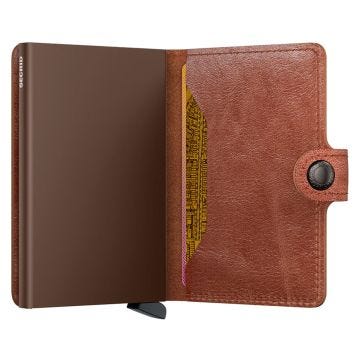 Photo of the Secrid Miniwallet Vintage Cognac Brown (MV-Cognac-Brown). Close-up image of the rich cognac brown wallet