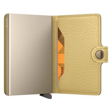 Photo of the Secrid Miniwallet Pebble Butter (MPe-ButterYellow). Close-up image of the butter yellow wallet