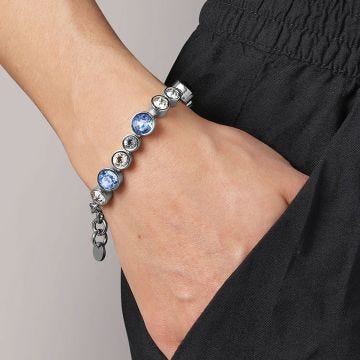 Photo of the DYRBERG/KERN Calice Silver Tone Bracelet adorned with blue and white crystals 460093