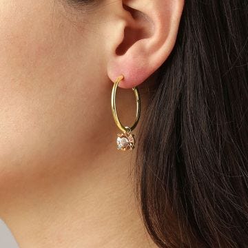 Photo of the DYRBERG/KERN Diega Gold Tone Hoop Earrings with pendant design, adorned with sparkling peach crystals 460050