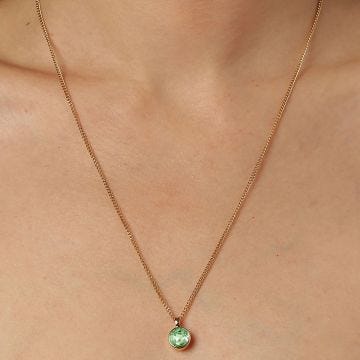 Photo of the DYRBERG/KERN Ette Gold Tone Pendant Necklace with a green crystal 460511