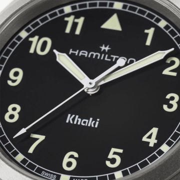 Hamilton Khaki Field 38mm Black Dial Quartz Watch H69401130, featuring a bold black dial with white Arabic numerals, luminous hands, and a sturdy stainless steel bracelet