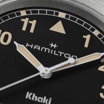 Photo of the Hamilton Khaki Field 38mm Black Dial Quartz Watch H69401131, showcasing a rugged black dial, luminous markers, and a brushed stainless steel bracelet