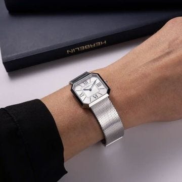 Photo of the Herbelin Octogone 24.5mm White Sunray Dial Quartz Watch 17426B08, featuring a sleek octagonal stainless steel case, white sunray dial, and refined mesh bracelet