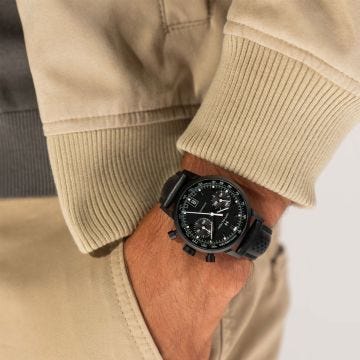 Photo of the Hamilton American Classic 40mm Black Dial Automatic Watch H38446730, featuring a sleek black dial, date window, and a smooth black leather strap 