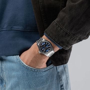 Photo of the Hamilton Khaki Field 38mm Blue Dial Automatic Watch H70605140, featuring a deep blue dial, day-date display, luminous numerals, and a robust stainless steel bracelet