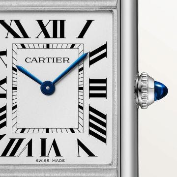 Photo of the Cartier Tank Must SolarBeat 33.7 x 25.5mm Silvered Dial Watch WSTA0090, powered by solar movement, featuring Roman numerals, blued steel hands, and a sustainable black leather strap.