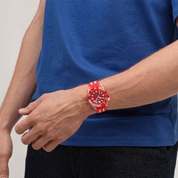 Photo of the Swatch Lion's Mane 44mm red dial quartz watch with red silicone strap, model SSCU09R100