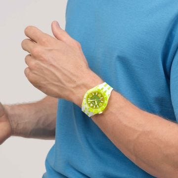 Photo of the Swatch Egg Yolk 44mm yellow dial quartz watch with yellow silicone strap, model SSCU09J100