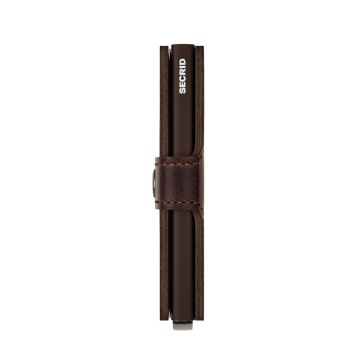 Photo of the Secrid Miniwallet Vintage Chocolate (MV-Chocolate). Close-up image of the chocolate brown wallet, showcasing its vintage leather and secure card storage mechanism.