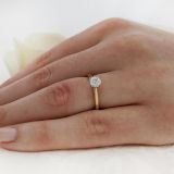 Yellow gold/platinum round brilliant cut diamond engagement ring