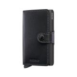 Photo of the Secrid Miniwallet Powdercoat Black (Mpc-Black). Close-up image of the sleek black wallet