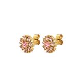 Photo of the DYRBERG/KERN Carnea Gold Tone Stud Earrings adorned with peach and rose crystals