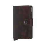 Photo of the Secrid Miniwallet Vintage Chocolate (MV-Chocolate). Close-up image of the chocolate brown wallet, showcasing its vintage leather and secure card storage mechanism.
